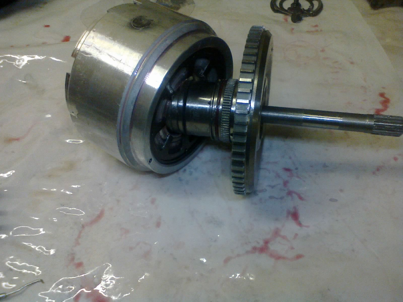 And the input hub slides into them from behind (or is it underneath? Uhhhh, well lemme put it this way: that input shaft ultimately points towards the engine ...which is mounted transversely, of course. So... yeah, whatever. Sideways, I guess.) Aaaaaaanyway...